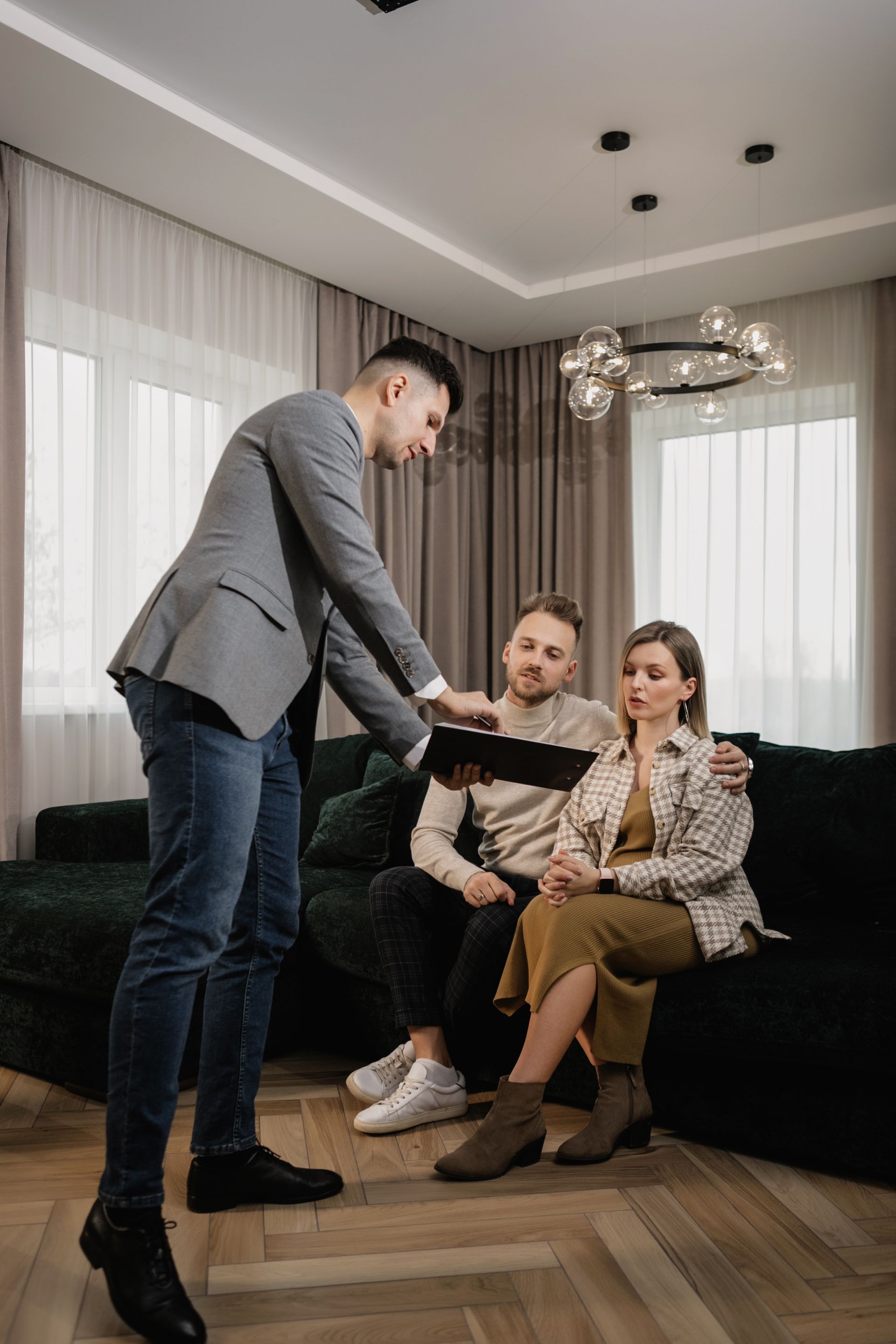 A One Group Realty agent going through the detail with clients